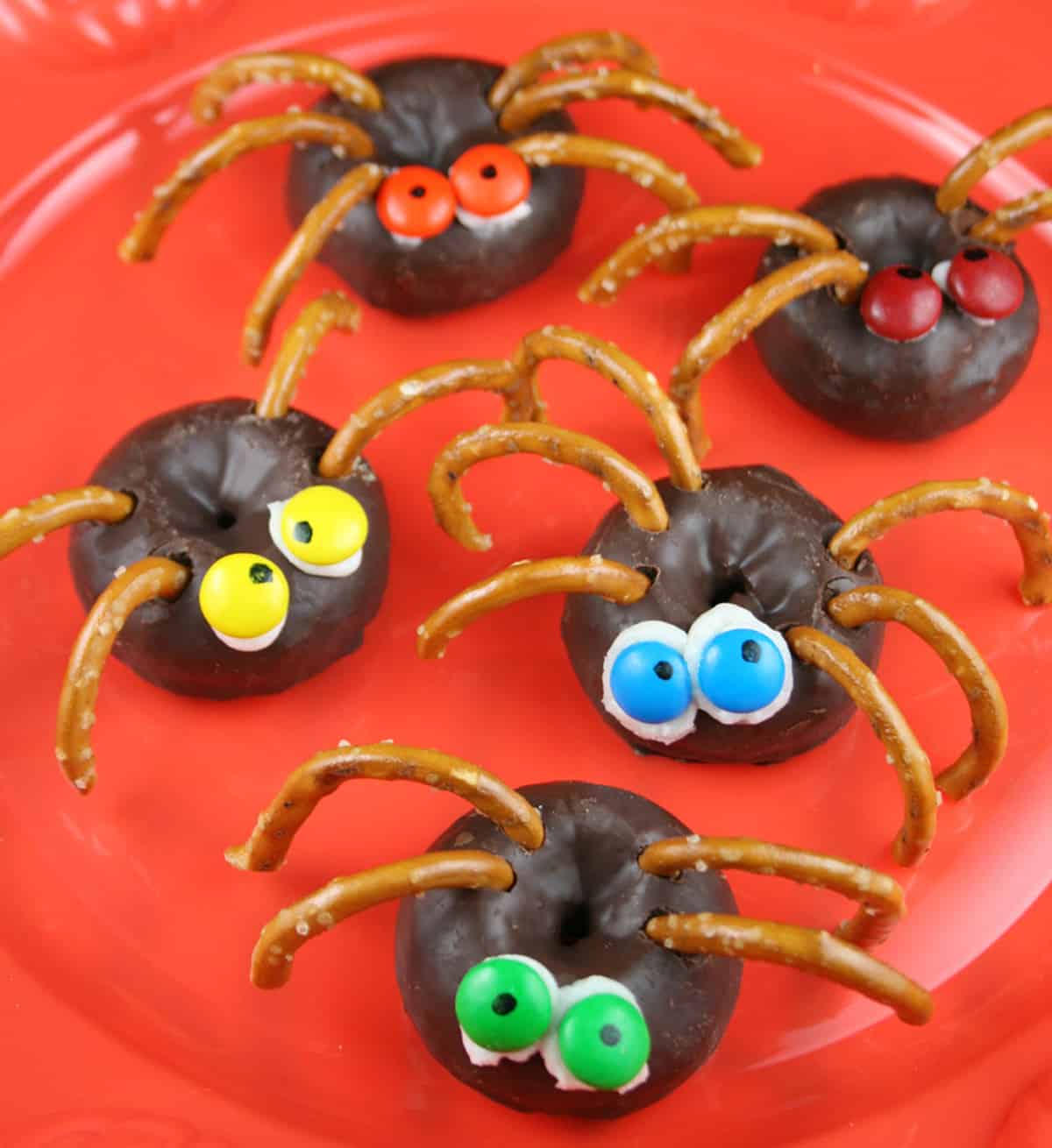Halloween spider donuts with pretzel legs.