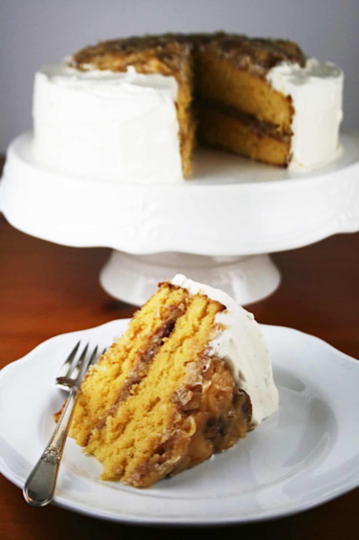 Butterscotch filling cake on cake stand.