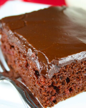 Chocolate Cherry Bar on white plate with fork.