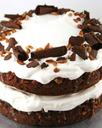 Chocolate layer cake with pralines and whipped cream filling.