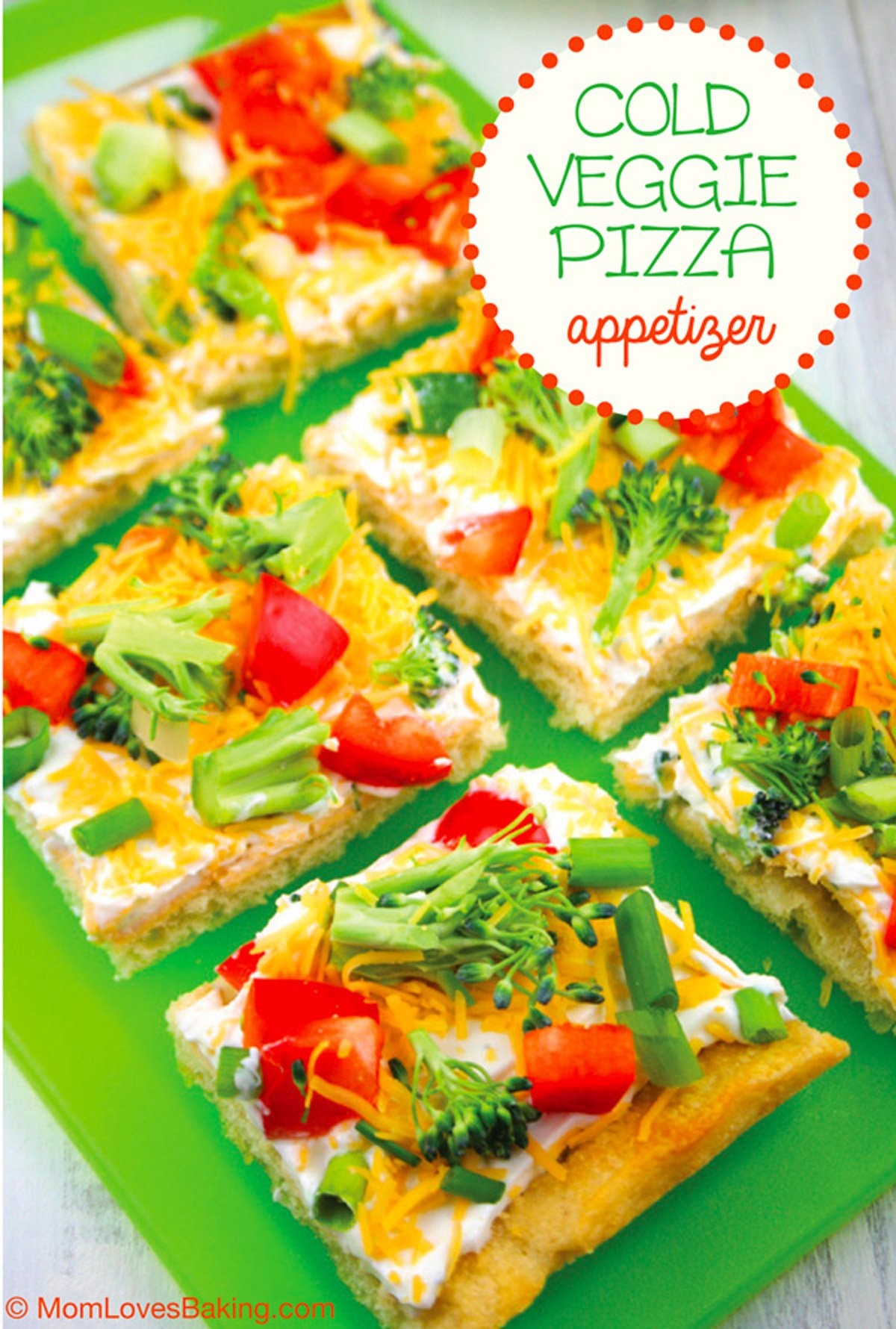 Yummy pizza appetizer on a green cutting board.