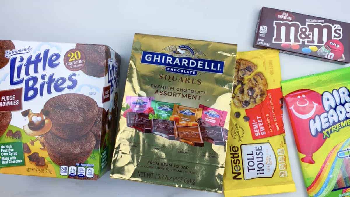 Ingredients on counter, Little Bites, Ghiradelli chocolate bars, chocolate chips, m&m candy and sour patch.