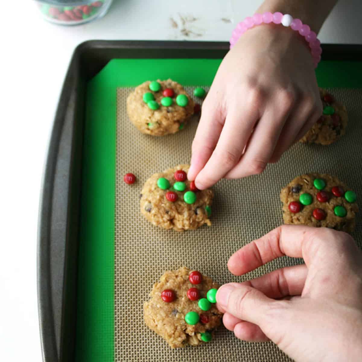 Placing cookie dough on baking sheet.