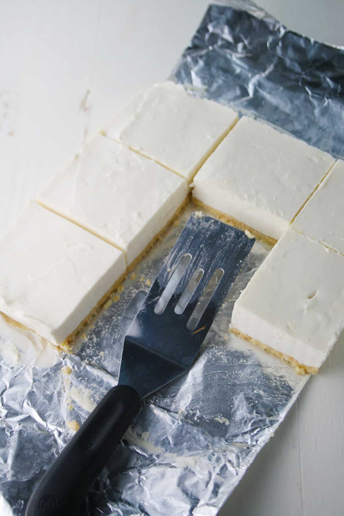 Cheesecake bars in pan.