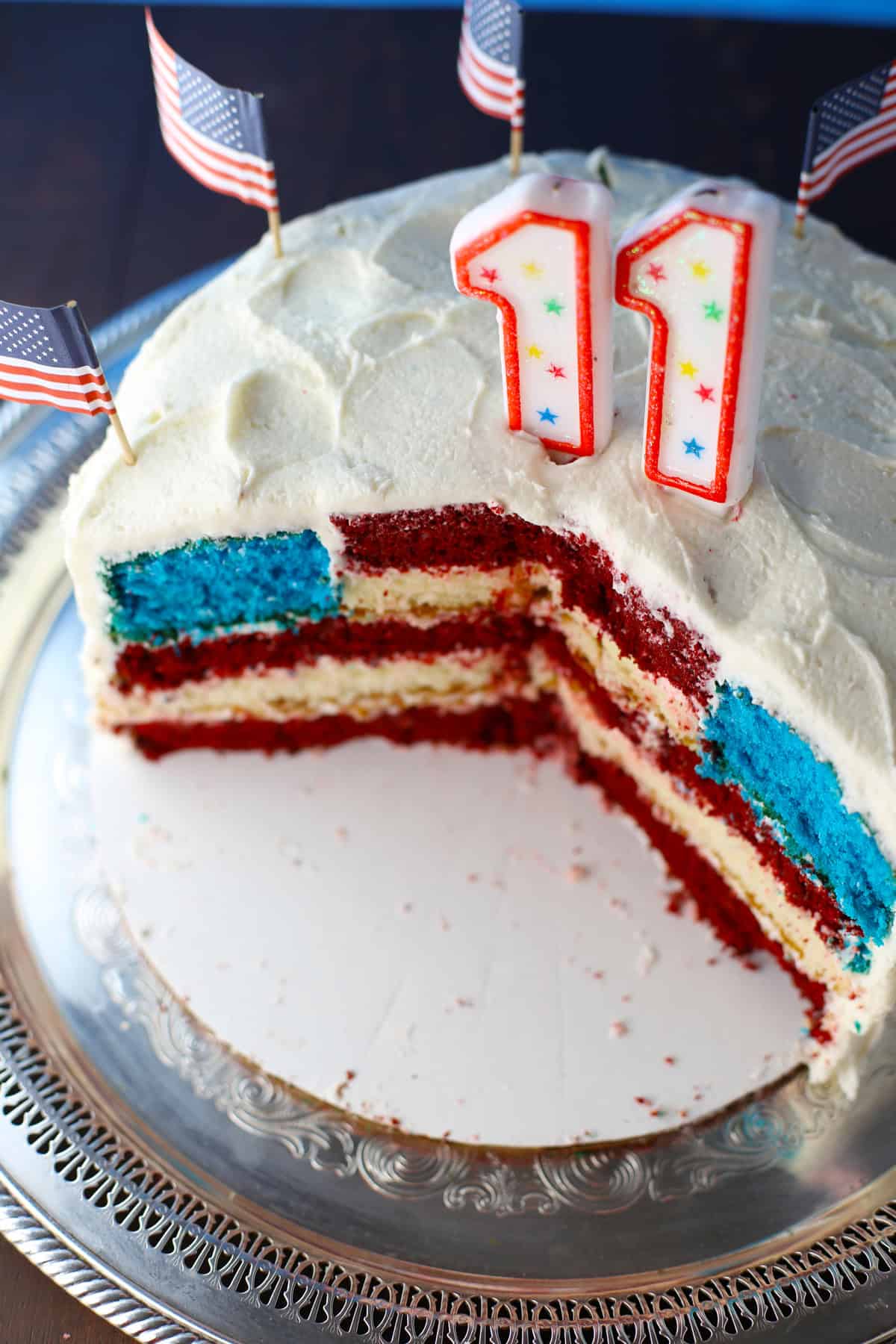 Sliced cake revealing the American flag design inside.