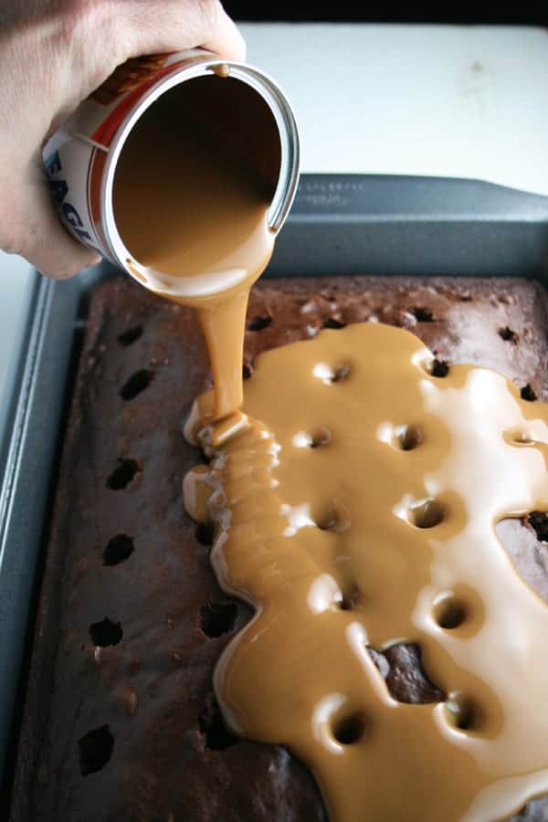 Caramel pouring over cake