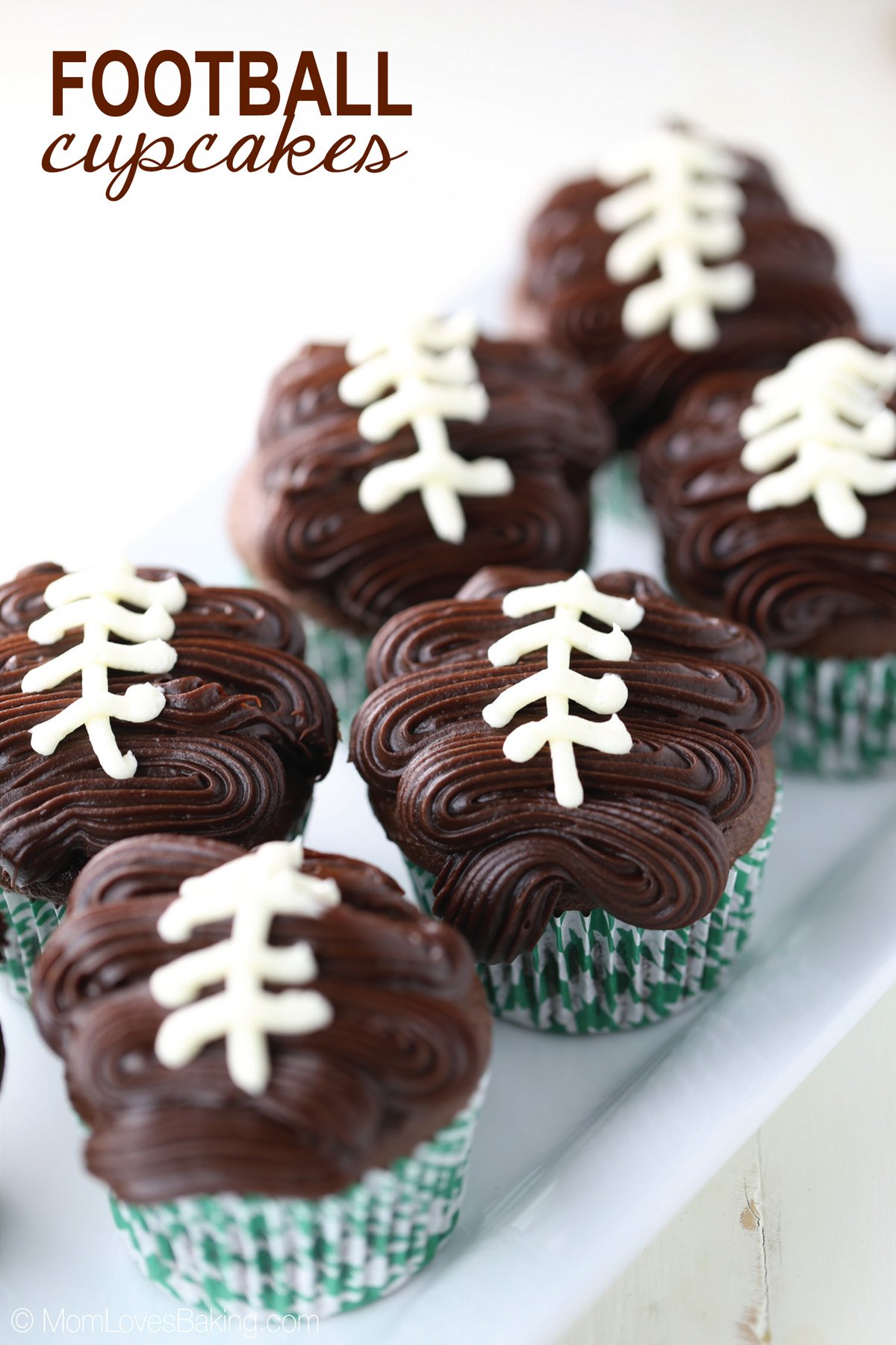 Football cupcakes with chocolate ganache frosting shaped like a football.