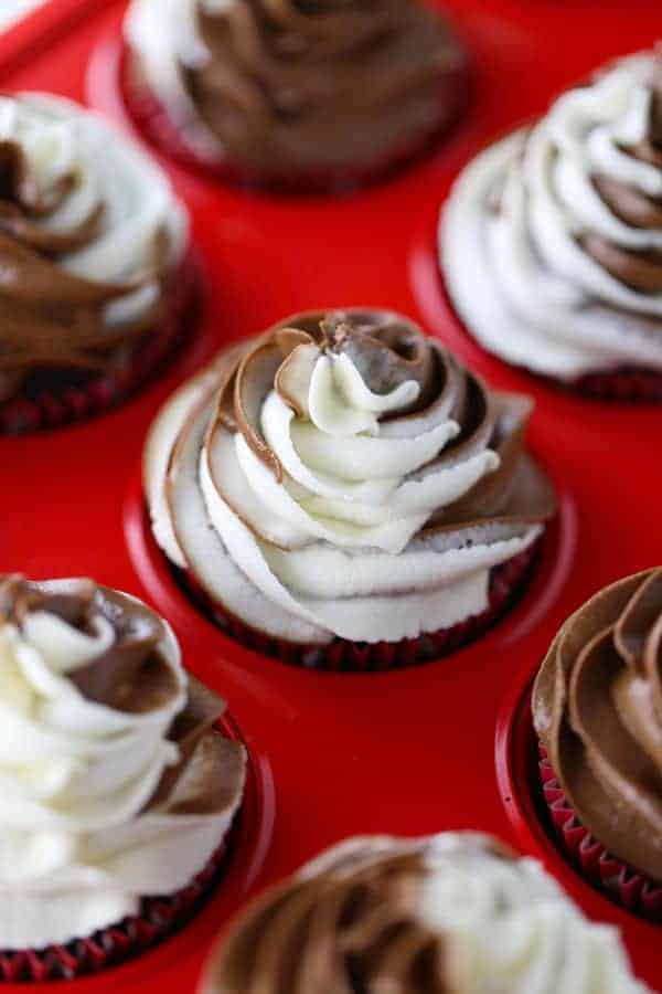 Gluten Free Chocolate Cupcakes with a swirl of dairy free chocolate and vanilla buttercream on top.