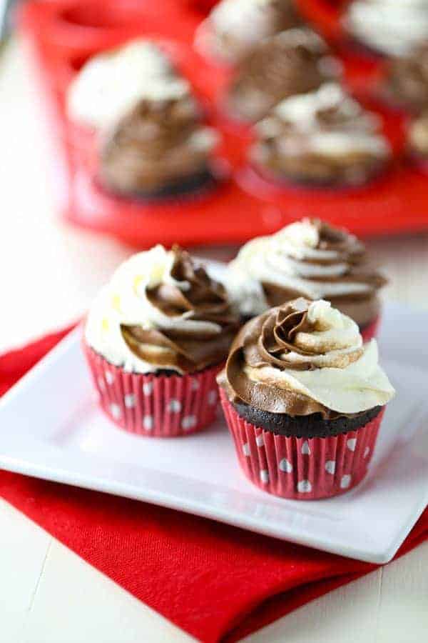 Gluten Free Chocolate Cupcakes with a swirl of dairy free chocolate and vanilla buttercream on top.