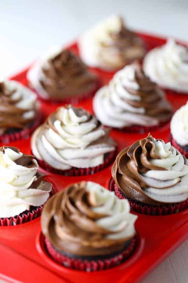 Gluten Free Chocolate Cupcakes with a swirl of dairy free chocolate and vanilla buttercream on top.