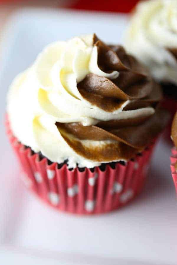 Gluten Free Chocolate Cupcakes with a swirl of dairy free chocolate and vanilla buttercream on top.