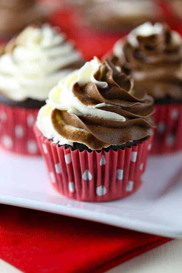 Gluten Free Chocolate Cupcakes with a swirl of dairy free chocolate and vanilla buttercream on top.