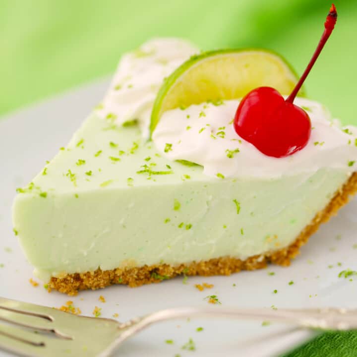 No bake key lime yogurt pie with cherry on top.