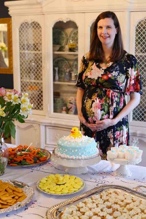 Baby Shower party food with blue cake for baby boy.