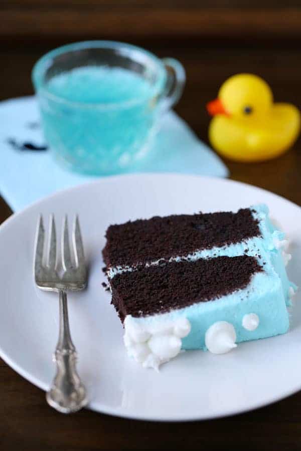 Slice of chocolate Baby Shower Cake with blue frosting.