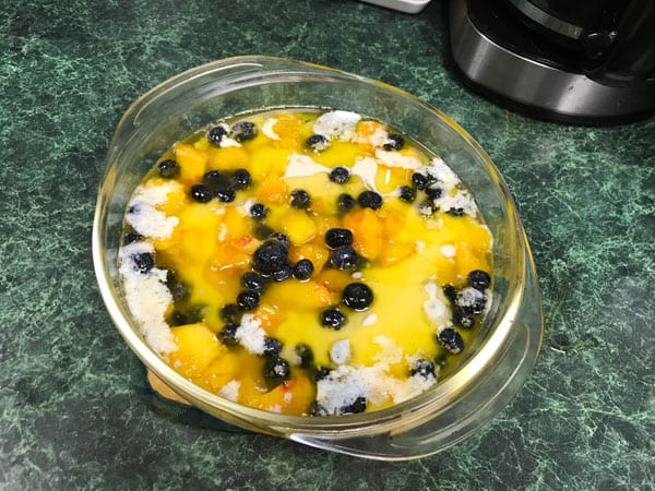 Grandmother's easy peach cobbler with blueberries