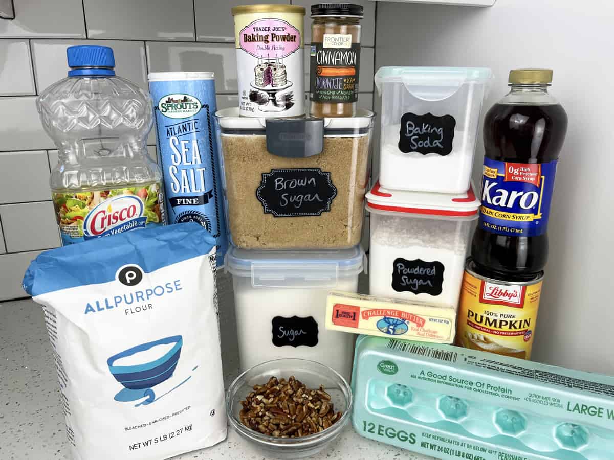 Ingredients on kitchen counter needed to make a pumpkin Bundt cake.