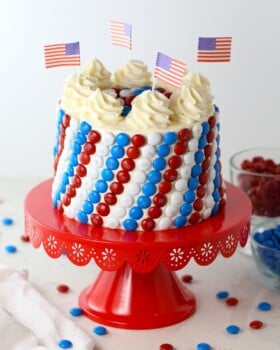 Vanilla cake with red, white and blue m&m's on the side.