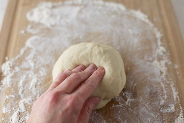 Knead homemade pizza dough