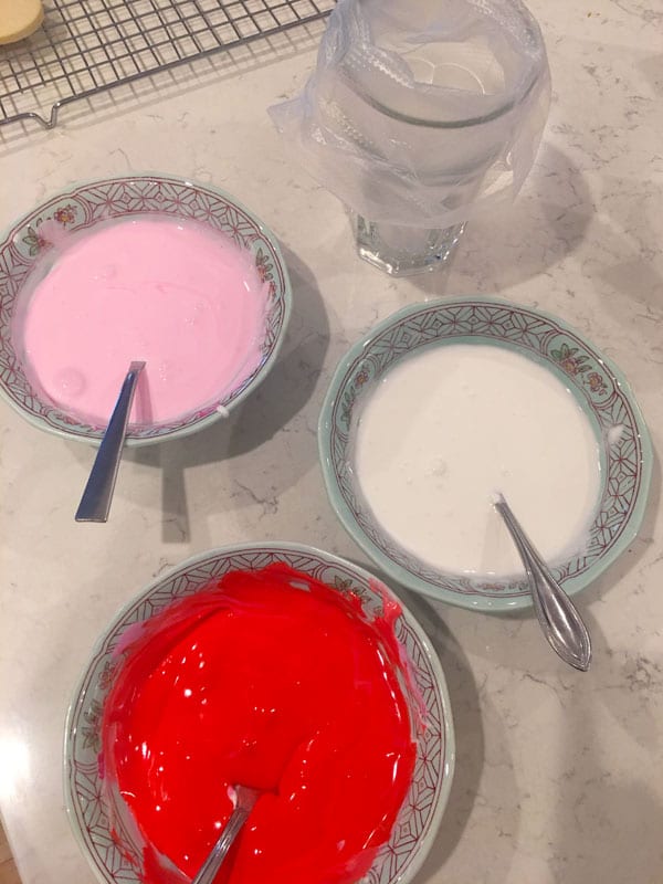 Royal icing colored red and pink