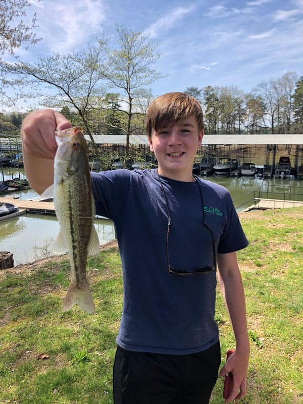 Teenage boy with fish