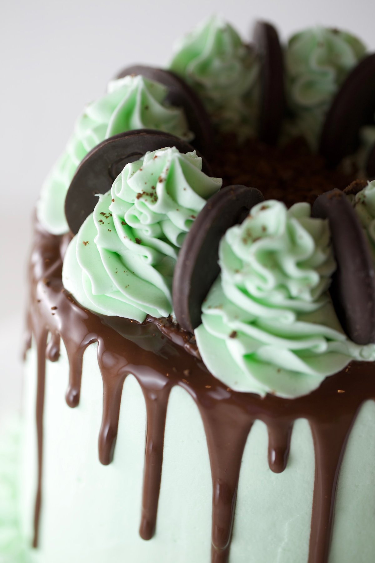 Delicious chocolate mint layer cake with crushed thin mints in center.