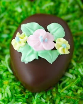 Chocolate covered peanut butter eggs with sugar flowers