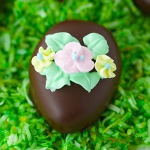 Chocolate covered peanut butter eggs with sugar flowers