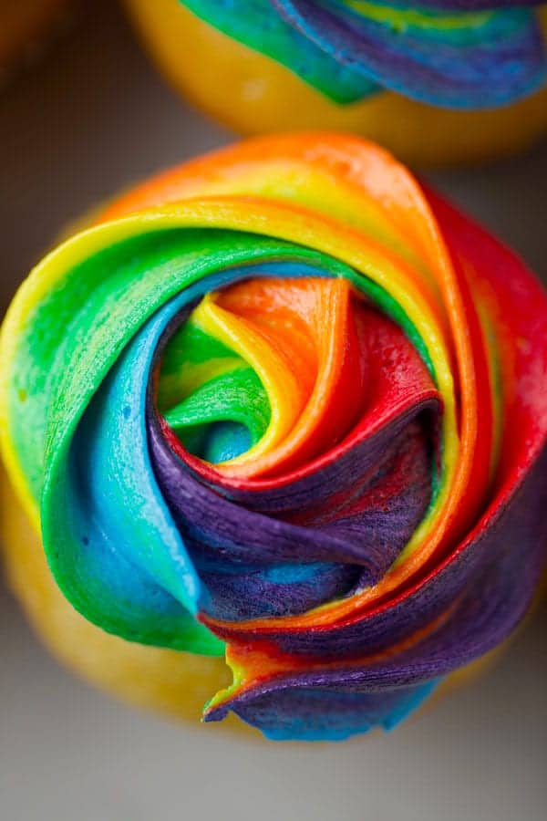 Close up of a rainbow frosted cupcake