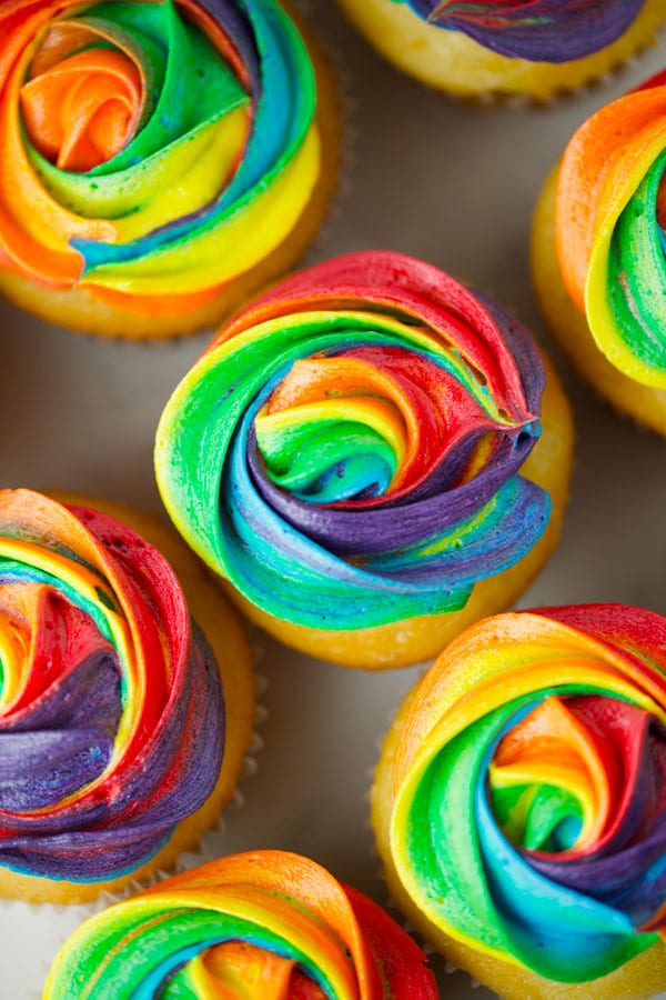 A bunch of rainbow cupcakes