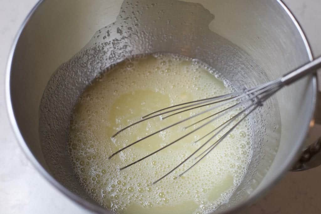 Whisk together egg whites and sugar