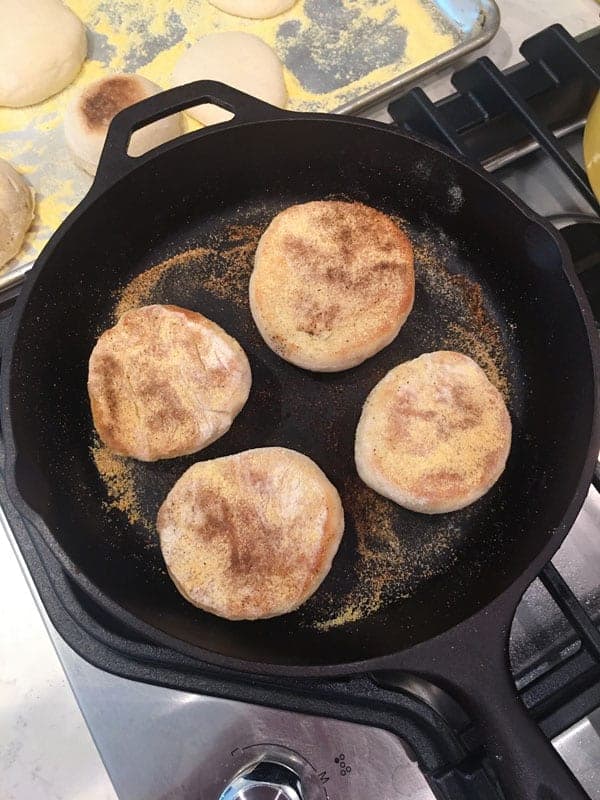 Frying Sourdough English Muffins in cast iron skillet