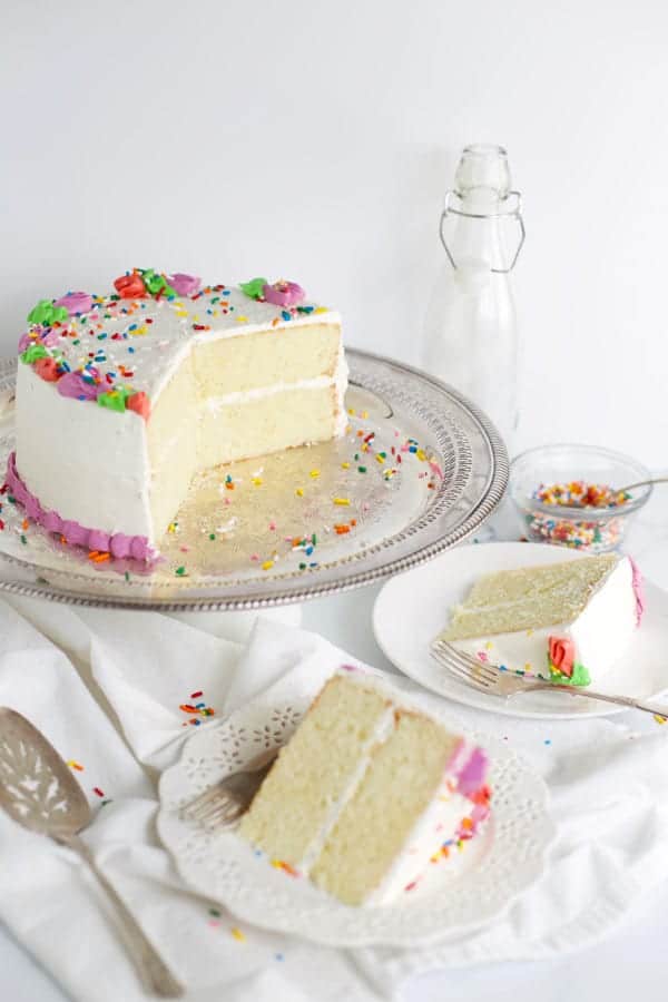 Slices of white cake on plates