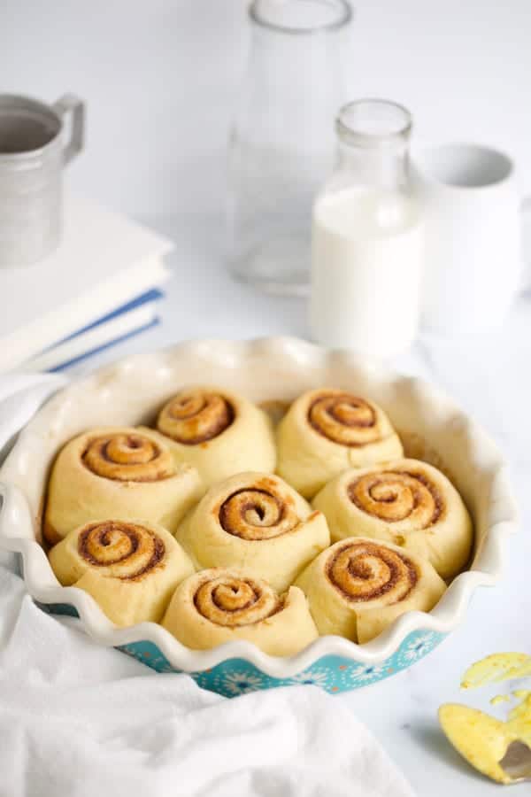 Naked cinnamon rolls before orange frosting