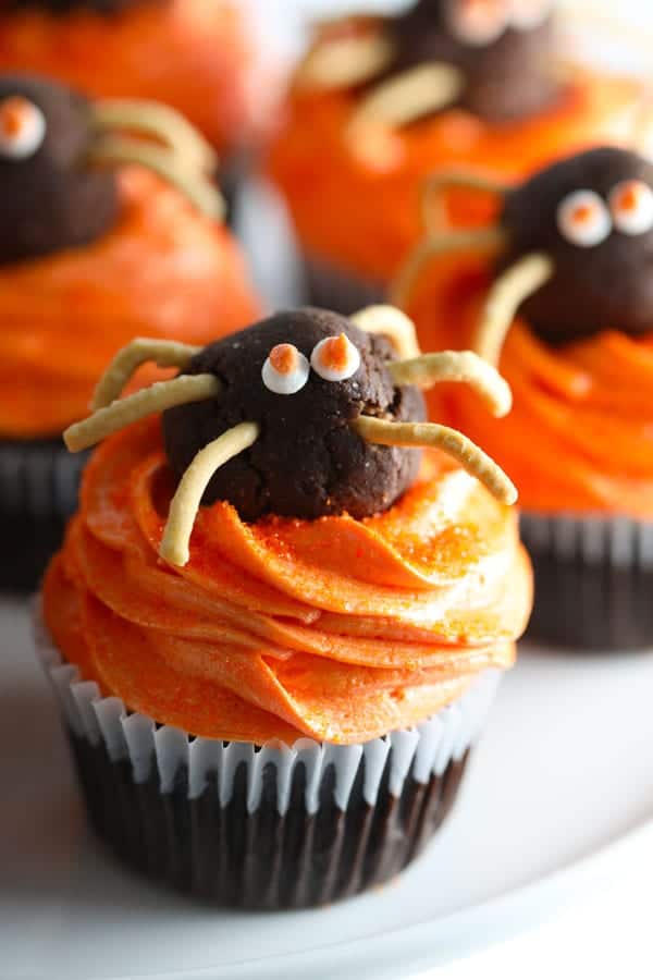 Cute halloween spider cupcakes are chocolate cupcakes with buttercream frosting and chocolate truffle spiders.