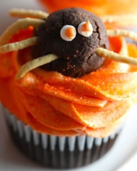 Halloween Spider cupcakes chocolate cupcakes with orange colored vanilla buttercream frosting with chocolate truffle spiders