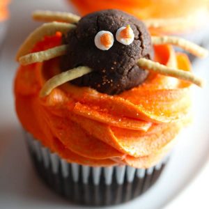 Halloween Spider cupcakes chocolate cupcakes with orange colored vanilla buttercream frosting with chocolate truffle spiders
