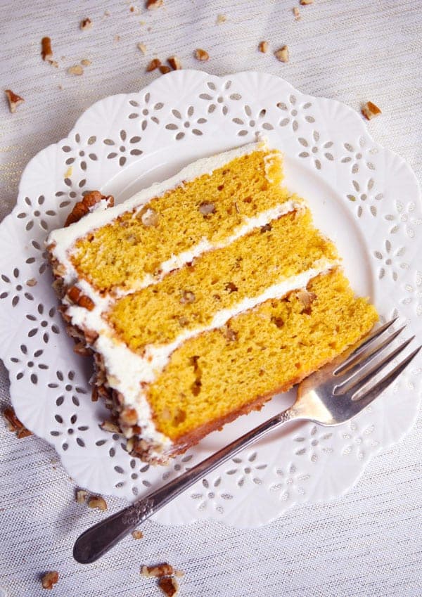 Slice of cake pumpkin spice cake with cream cheese frosting