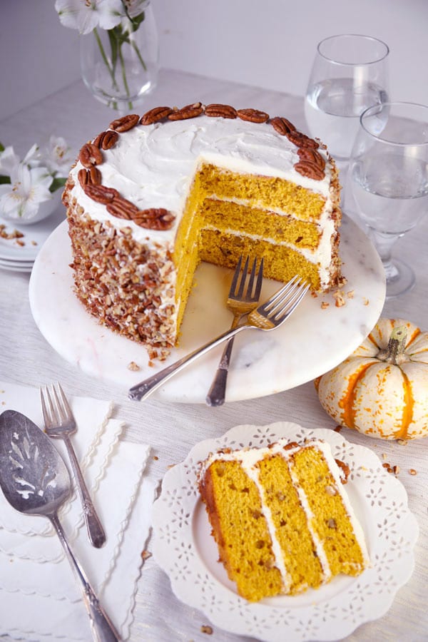 Pumpkin spice pecan layer cake with cream cheese frosting sliced