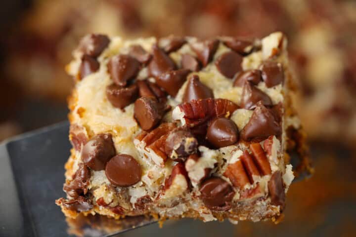 Seven Layer Magic Cookie Bars - Mom Loves Baking