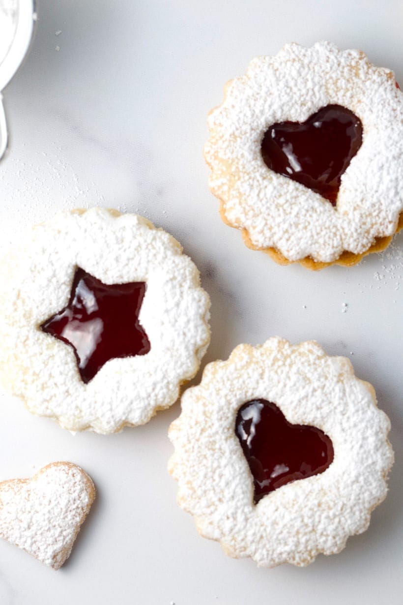 Raspberry jam filled almond linzer cookies gluten free holiday cookies