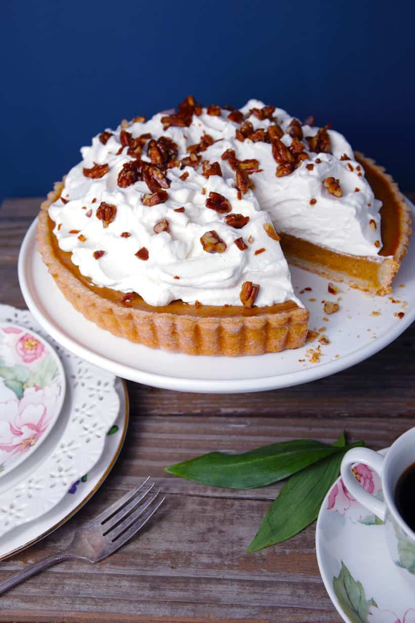 Turtle pumpkin pie with whipped cream and pecan toffee