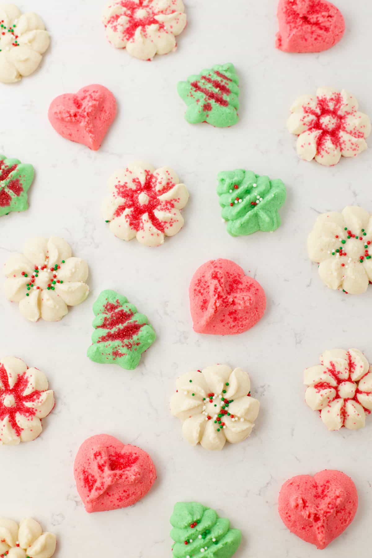 Red, white and green Christmas cookies with sprinkles.