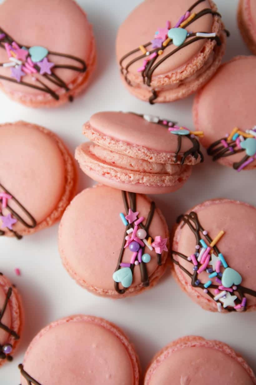 Pink macaron shells with strawberry buttercream filling