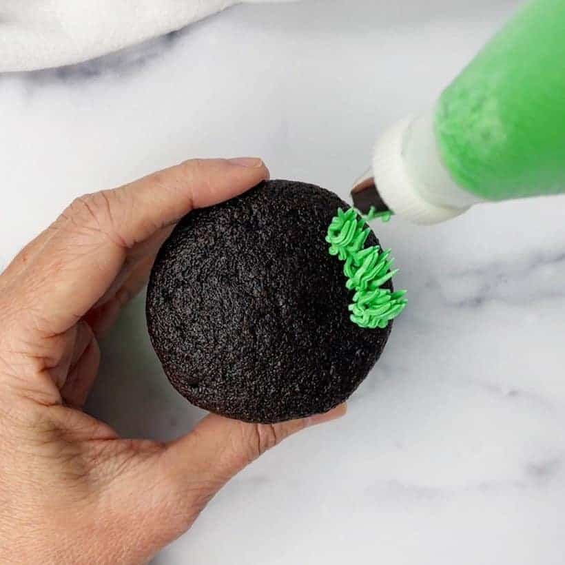 Frosting football grass cupcakes