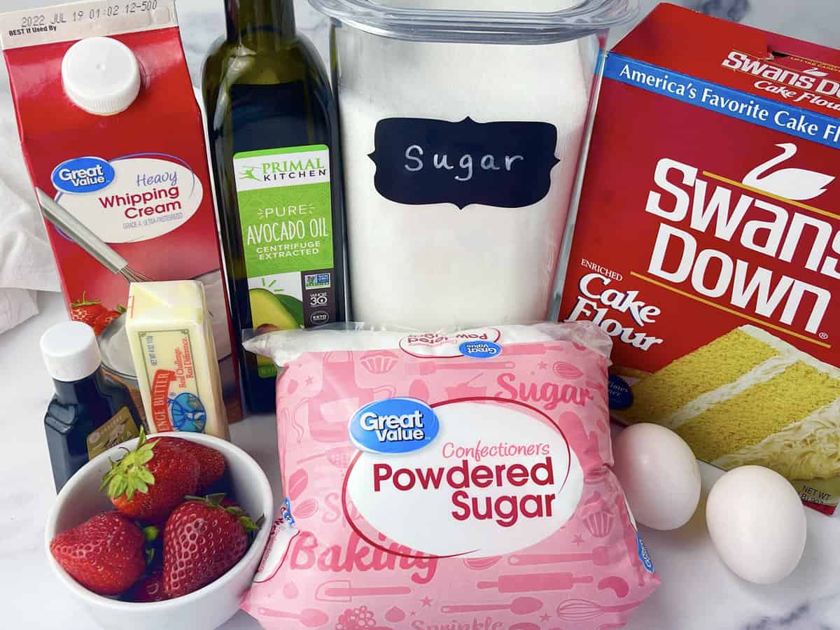 Ingredients needed to make a cake roll with cherry design.