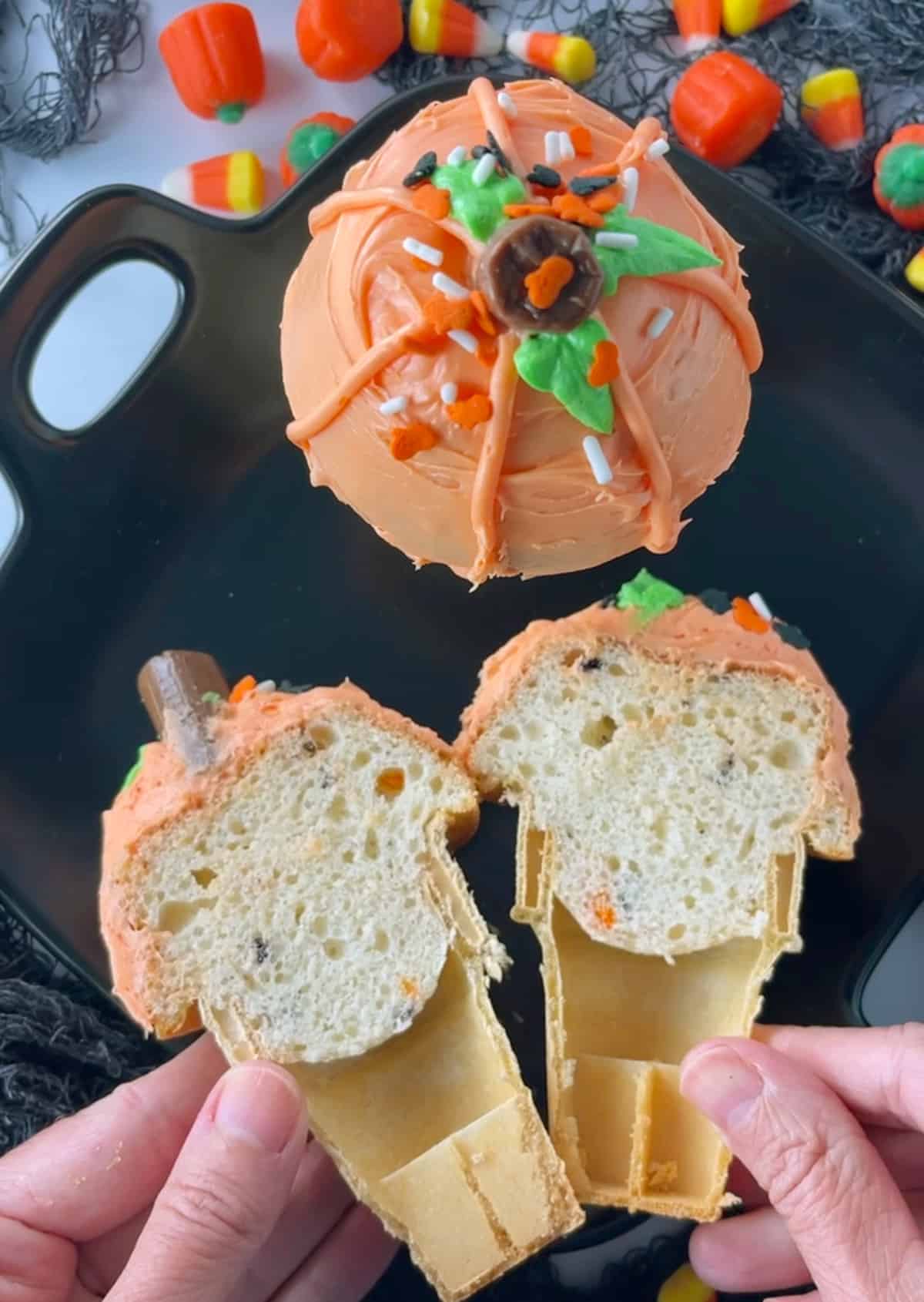 The cone with cake inside cut in half to show what it looks like.