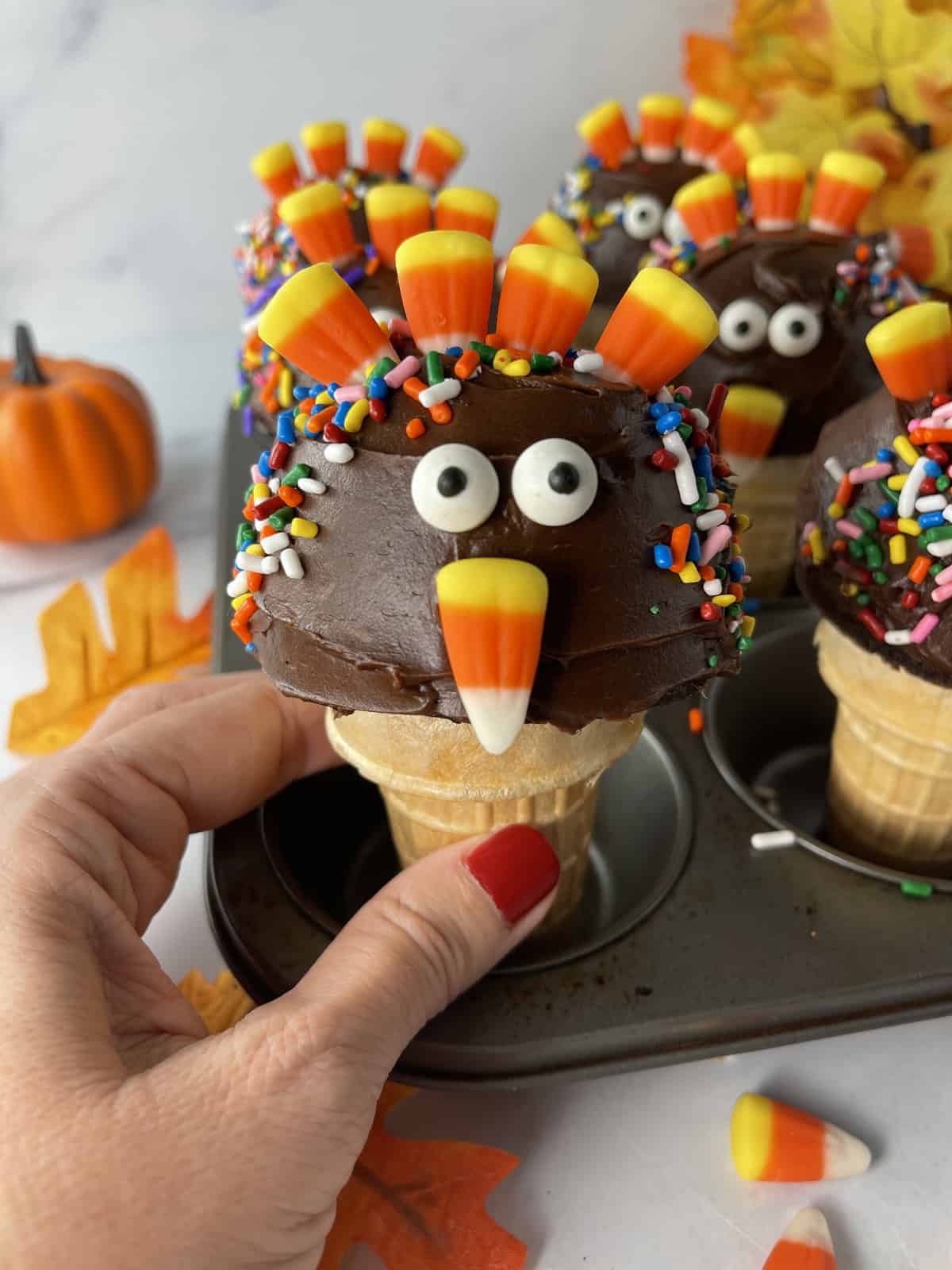 Cupcake baked in ice cream cone then decorated to look like a cute turkey with candy corn feathers.