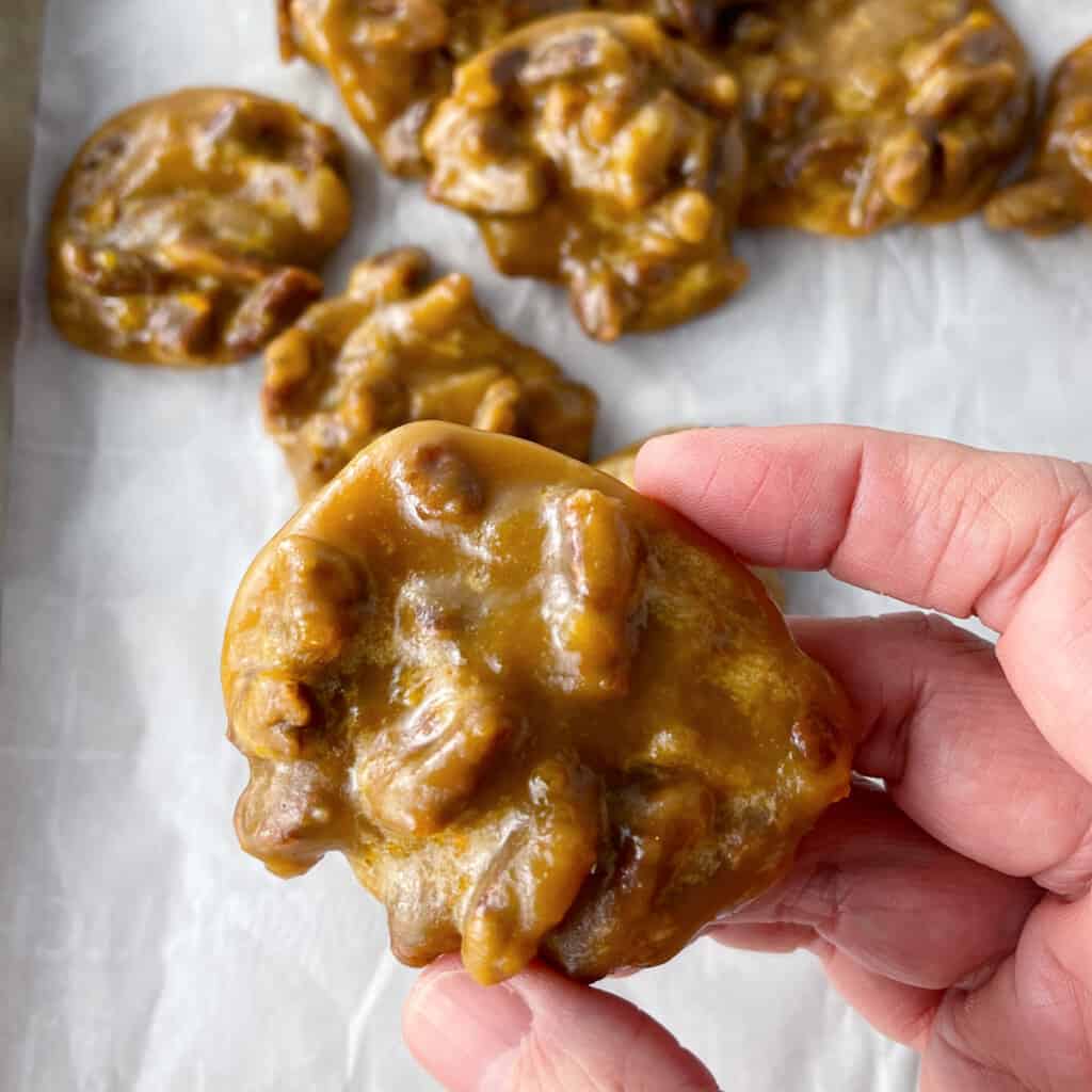 Homemade pecan pralines on a cookie sheet.