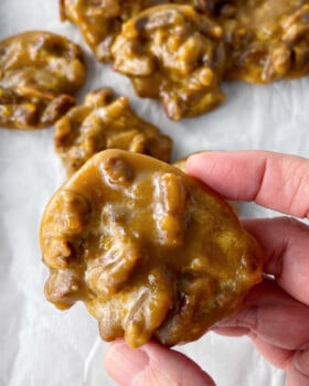 Homemade pecan pralines on a cookie sheet.
